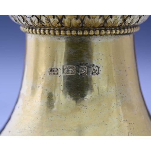 113 - Guild of Handicraft (George Henry Hart), an Edward VII silver-gilt Arts & Crafts style candlestick, ... 