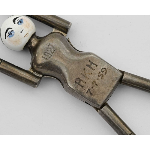 144 - A single pair of early twentieth-century silver 'Dutch Doll' sugar tongs, by Cohen & Charles, London... 