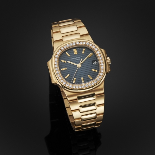 216 - 
Patek Philippe 
A Nautilus bracelet watch. Circa 1984
Case: Signed. 18ct gold. Bezel set with diamo... 
