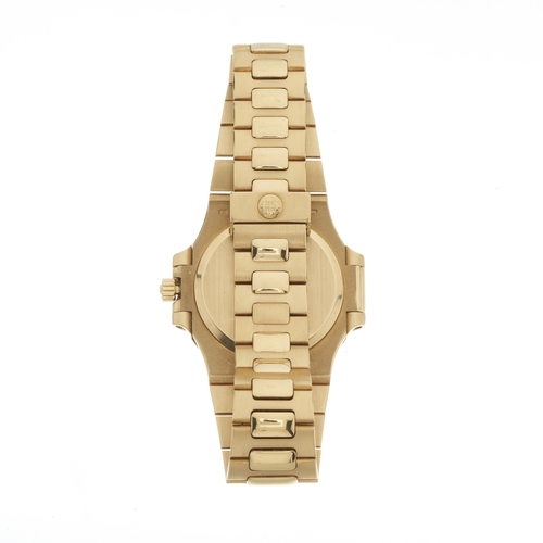 216 - 
Patek Philippe 
A Nautilus bracelet watch. Circa 1984
Case: Signed. 18ct gold. Bezel set with diamo... 