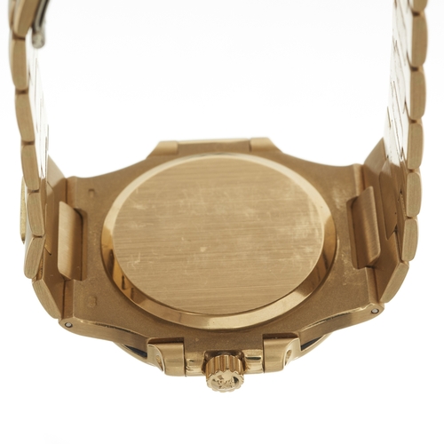 216 - 
Patek Philippe 
A Nautilus bracelet watch. Circa 1984
Case: Signed. 18ct gold. Bezel set with diamo... 