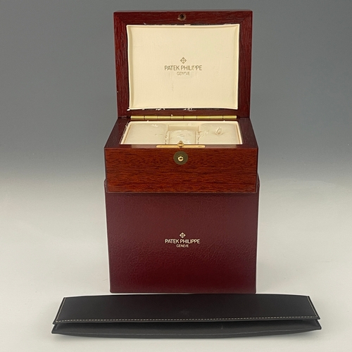 216 - 
Patek Philippe 
A Nautilus bracelet watch. Circa 1984
Case: Signed. 18ct gold. Bezel set with diamo... 