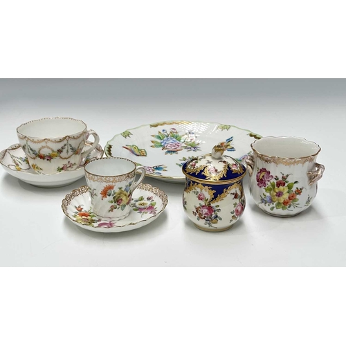 109 - A collection of continental ceramics, to include a Dresden tea cup and saucer painted with floral ga... 