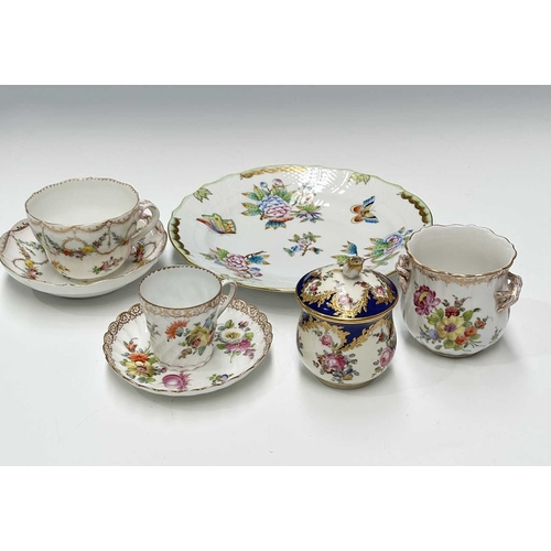 109 - A collection of continental ceramics, to include a Dresden tea cup and saucer painted with floral ga... 