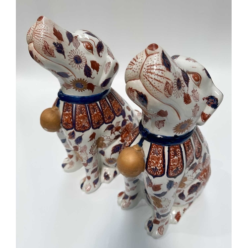 115 - A pair of decorative Imari-patterned chimney dogs, 35cm high (2)