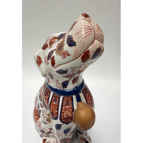 115 - A pair of decorative Imari-patterned chimney dogs, 35cm high (2)