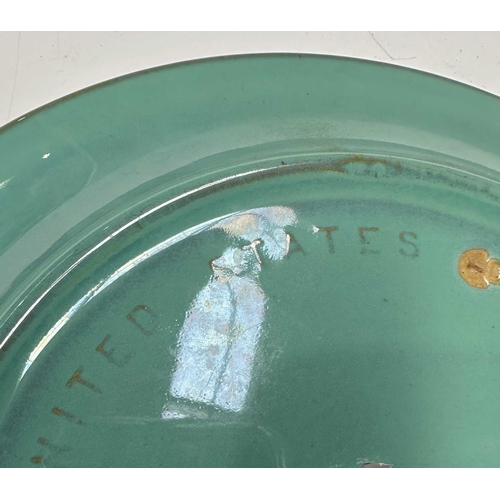 117 - United States Quarry Tile Company, a Romany art pottery sgraffito decorated plate, incised with a st... 