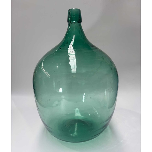 119 - A large hand blown green glass carboy or bottle, height approx 50cm (1)