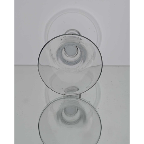 122 - A plain stemmed wine glass, circa 1750, the bell shaped bowl on a plain cylindrical stem and folded ... 
