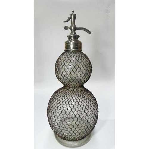 126 - An early 20th century glass and wire mesh double-gourd soda syphon, chrome tap, French, marked Vérit... 