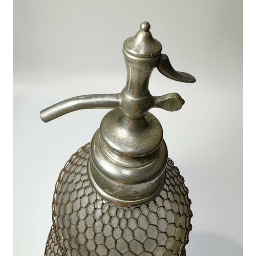 126 - An early 20th century glass and wire mesh double-gourd soda syphon, chrome tap, French, marked Vérit... 