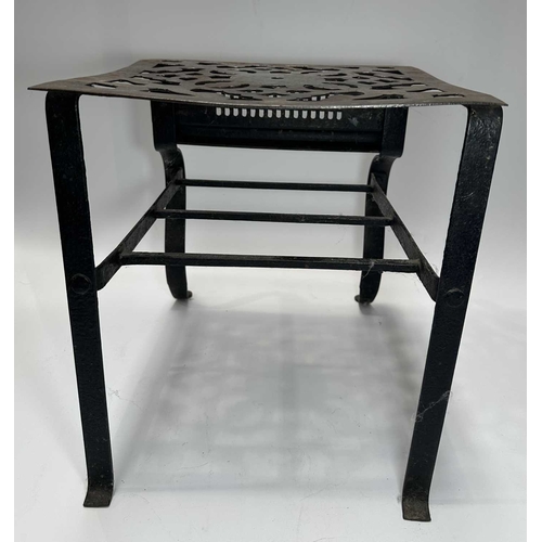 128 - A Georgian steel footman or fireside stall, cut away top, fretted front rail, square back legs and b... 