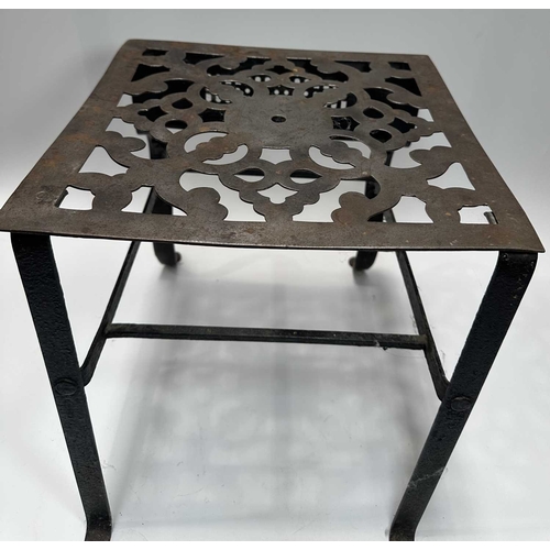 128 - A Georgian steel footman or fireside stall, cut away top, fretted front rail, square back legs and b... 