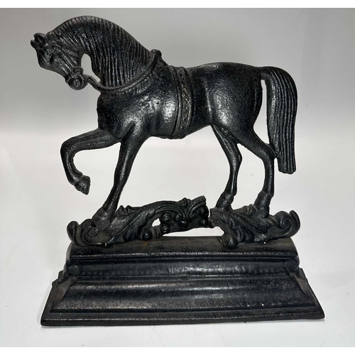 128 - A Georgian steel footman or fireside stall, cut away top, fretted front rail, square back legs and b... 