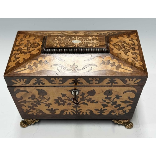 129 - A Regency Inlaid tea caddy of sarcophagus form with marquetry work to the front and top, mounted on ... 