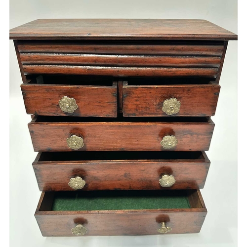 131 - A stained pitch pine, scratch built, apprentice piece chest of drawers, two over three, with secret ... 