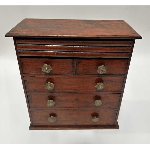 131 - A stained pitch pine, scratch built, apprentice piece chest of drawers, two over three, with secret ... 