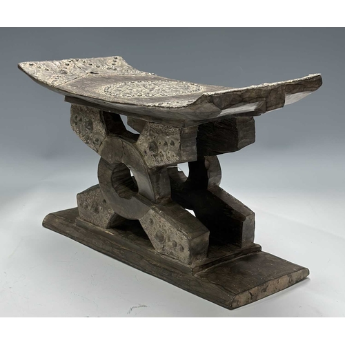 132 - An Ashanti (Asante) stool or Asesedwa, hand carved tribal Ghanaian crescent shaped seat, double pede... 