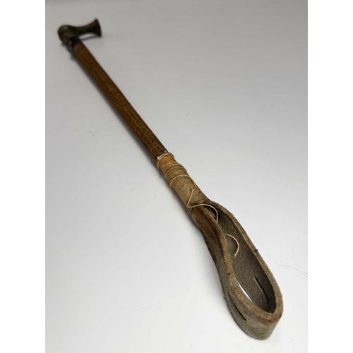 134 - A late 19th early 20th century ladies parasol, carved horn handle and tip, cane shaft with white met... 