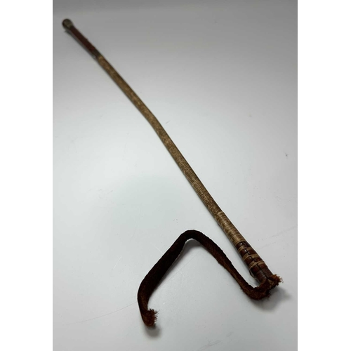 134 - A late 19th early 20th century ladies parasol, carved horn handle and tip, cane shaft with white met... 