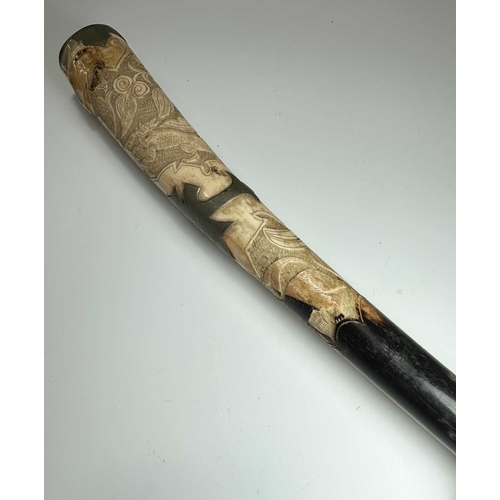 134 - A late 19th early 20th century ladies parasol, carved horn handle and tip, cane shaft with white met... 