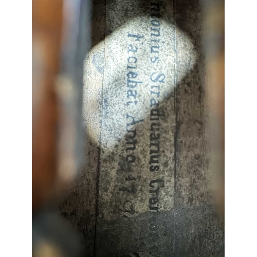 138 - A half-size 19th-century violin, label affixed to the interior on the bass bar reads 'Antonius Strad... 