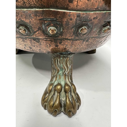 139 - A 19th century copper log bucket or coal scuttle, panels of copper riveted with brass, supported on ... 