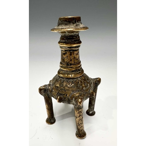 142 - A collection of Indian metalware, to include a cosmetics pot/Kohl maker on four brass legs, h: 11cm,... 