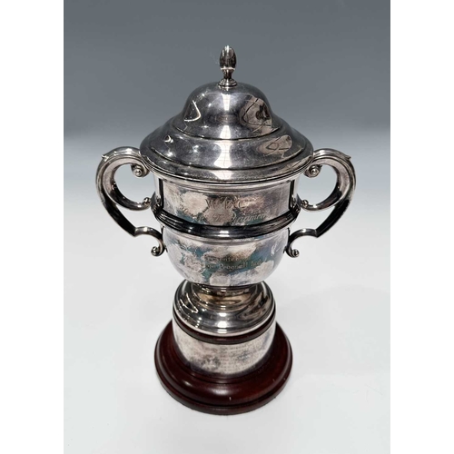 144 - A twentieth-century plated trophy cup and cover, for the 'W.F.C. Golf Tournament...Presented by Geor... 