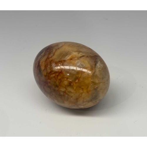 145 - A carved fluorspar type egg, together with a bronze pedestal tripod stand or tazza, probably 19th ce... 