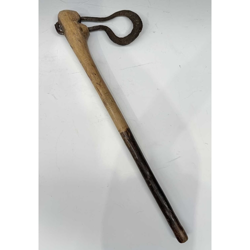 153 - A tribal club or axe, likely a West African Fon Ceremonial Axe, the wooden handle with scratch carvi... 