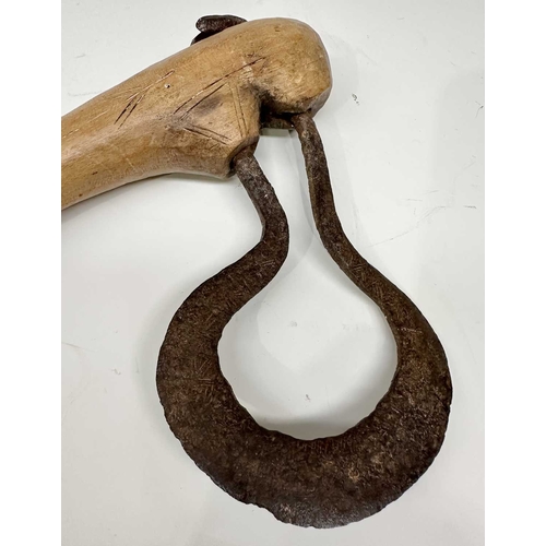 153 - A tribal club or axe, likely a West African Fon Ceremonial Axe, the wooden handle with scratch carvi... 