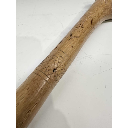 153 - A tribal club or axe, likely a West African Fon Ceremonial Axe, the wooden handle with scratch carvi... 