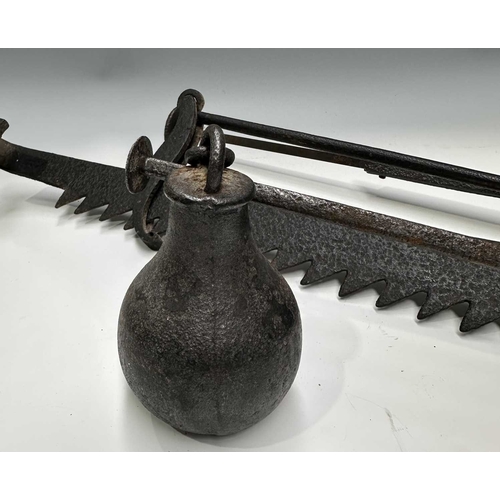 154 - A cast iron butchers hook or steelyard balance scale, length 67cm, together with a wrought iron tram... 