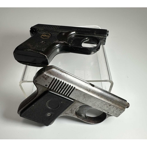 157 - Two vintage starter pistols, one in black steel and marked 'ROHM RG2' with a mock-tortoiseshell hand... 