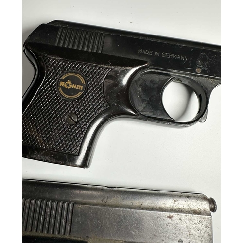 157 - Two vintage starter pistols, one in black steel and marked 'ROHM RG2' with a mock-tortoiseshell hand... 