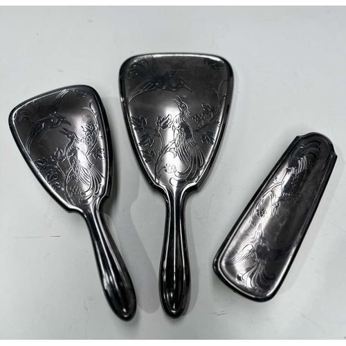 158 - A silver dressing table set, two brushes, a comb and a handheld mirror, Broadway & Co, Birmingham, 1... 