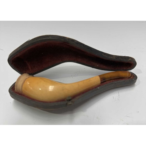 160A - Three Meerschaum pipes, early 20th Century, one a bird of prey talon, one a hand, one bud-shaped, al... 