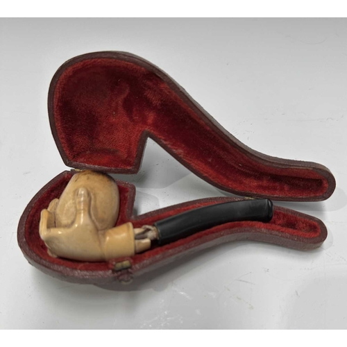 160A - Three Meerschaum pipes, early 20th Century, one a bird of prey talon, one a hand, one bud-shaped, al... 