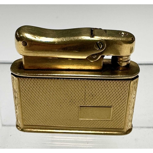 167 - A Dunhill plated lighter, together with a gilt Calibri lighter, and a gilt metal 'Jewel' lighter, wi... 