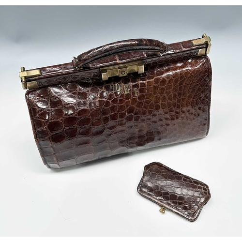 172 - A vintage crocodile Gladstone bag w/ matching purse, featuring gold-tone hardware including the init... 
