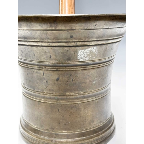 175 - A large and heavy bell metal mortar, 19th century or earlier, with ring turned decoration, height 22... 