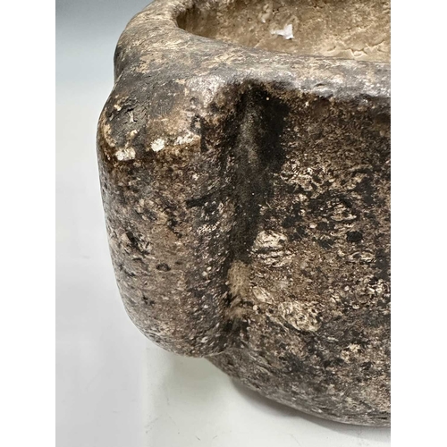 176 - A stone mortar, carved from limestone, possibly Purbeck marble and possibly Middle Ages, four lugs, ... 