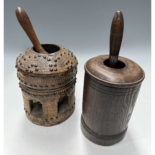 177 - A tribal wooden mihbaj/mehbash, probably Bedouin, a coffee grinder carved from a single piece of woo... 