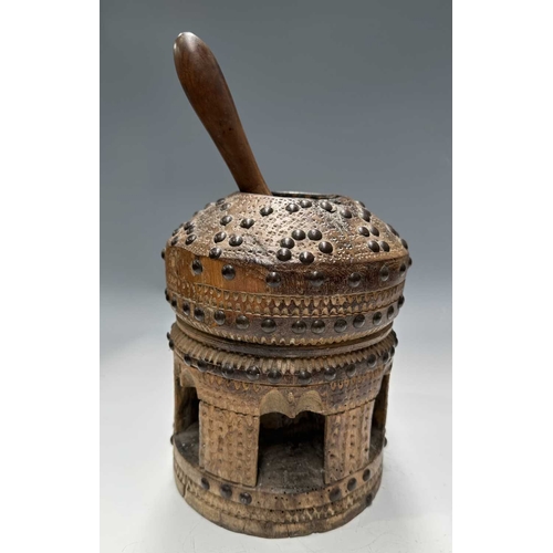 177 - A tribal wooden mihbaj/mehbash, probably Bedouin, a coffee grinder carved from a single piece of woo... 