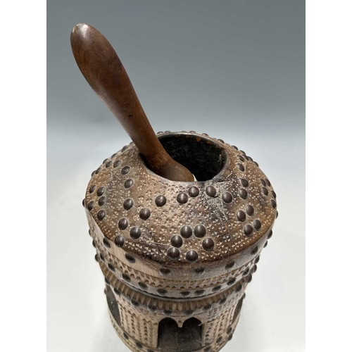 177 - A tribal wooden mihbaj/mehbash, probably Bedouin, a coffee grinder carved from a single piece of woo... 