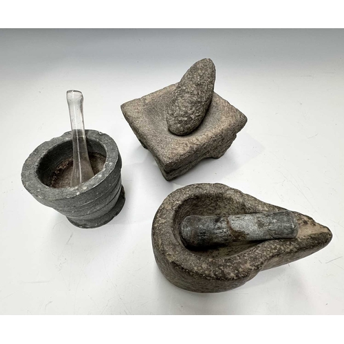 179 - A small stone, possibly ancient, pear-shaped mortar with pouring spout, height 6cm, a square basalt ... 