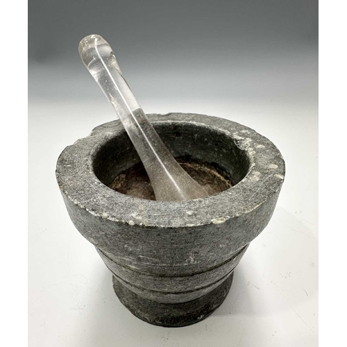 179 - A small stone, possibly ancient, pear-shaped mortar with pouring spout, height 6cm, a square basalt ... 