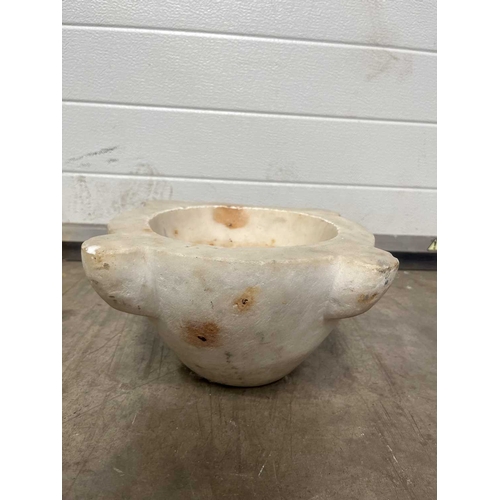 181A - A large white marble mortar, with four lugs, carved from a single block of marble, height 23cm, aver... 