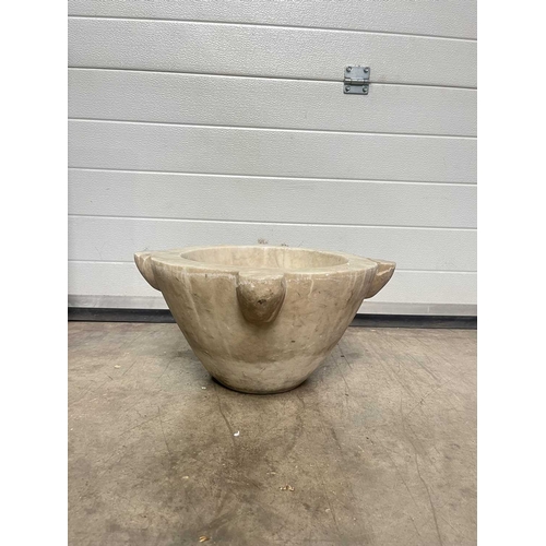 181A - A large white marble mortar, with four lugs, carved from a single block of marble, height 23cm, aver... 